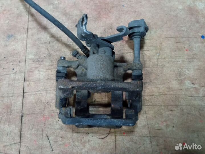 Суппорт тормозной задний правый Опель Астра J