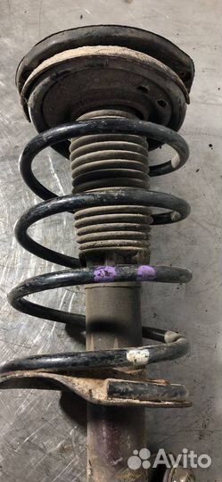 Стойка амортизатора передняя левая Peugeot 206