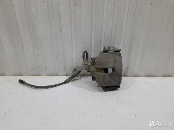 Суппорт тормозной передний левый Volkswagen Passat