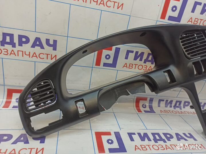 Накладка декоративая на торпедо центральная Kia Spectra (SD) 0K2N15542002