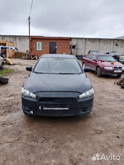 Суппорт тормозной передний Mitsubishi Lancer CY