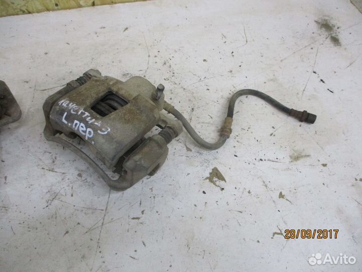 Суппорт передний Шевроле Лачетти