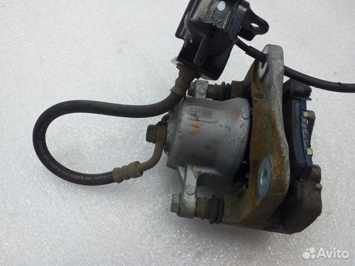 Суппорт тормозной задний левый Toyota Rav4 XA40