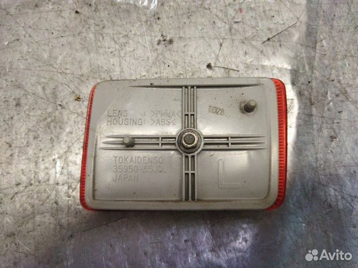 Отражатель в бампер задний левый Suzuki Grand