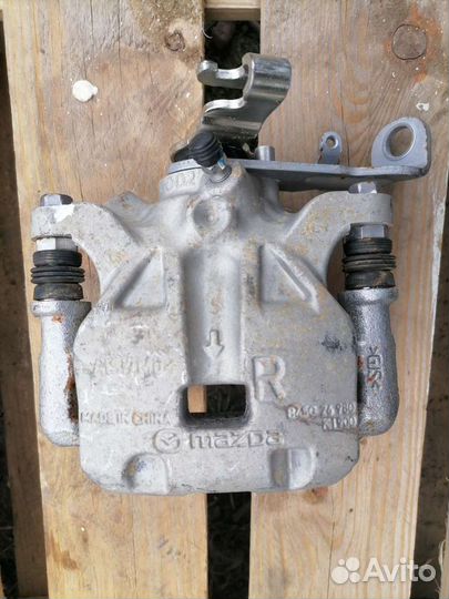 Задний тормозной суппорт мазда 3 bm