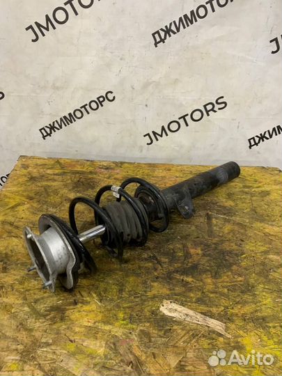 Стойка амортизатора передняя левая BMW E87