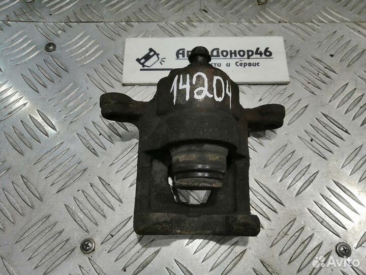 Суппорт тормозной задний левый Nissan Teana J31