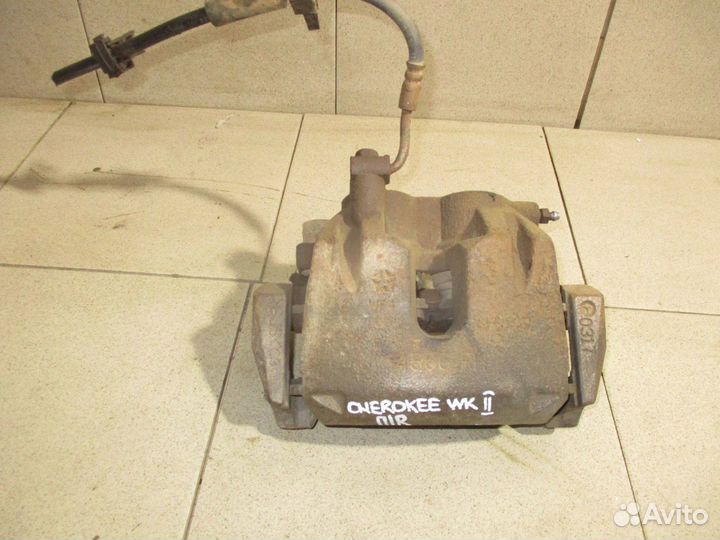 Суппорт передний правый Jeep Grand Cherokee 4