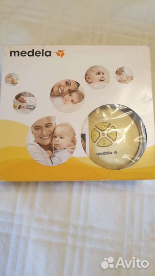 Молокоотсос medela электрический