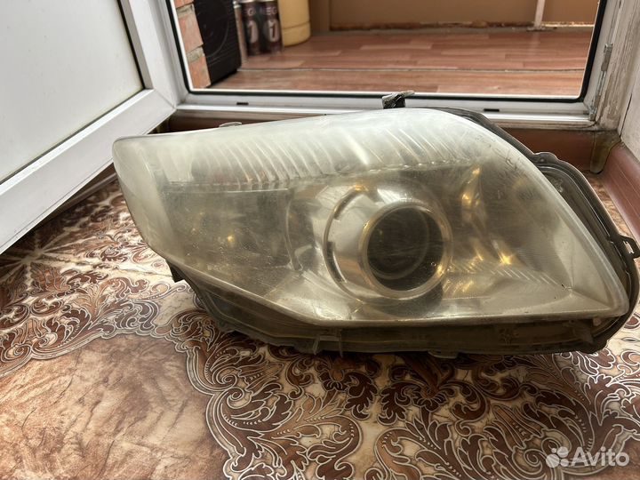 Фара Toyota corolla fielder NZE 141