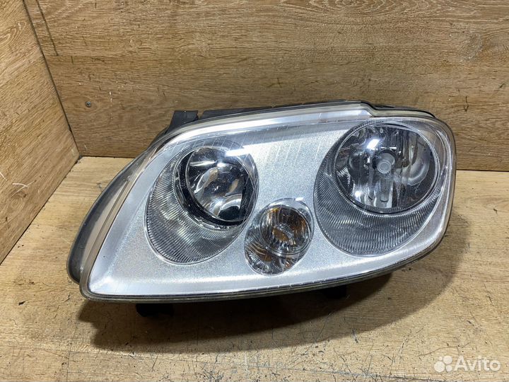 Фара передняя левая Volkswagen Caddy 3 142163