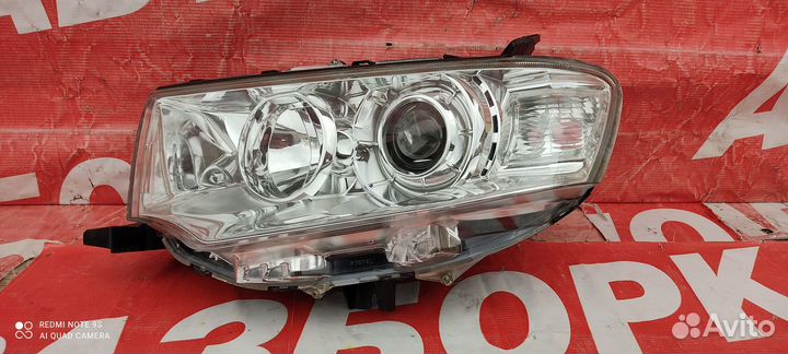 Фара левая Mitsubishi Pajero/Montero Sport
