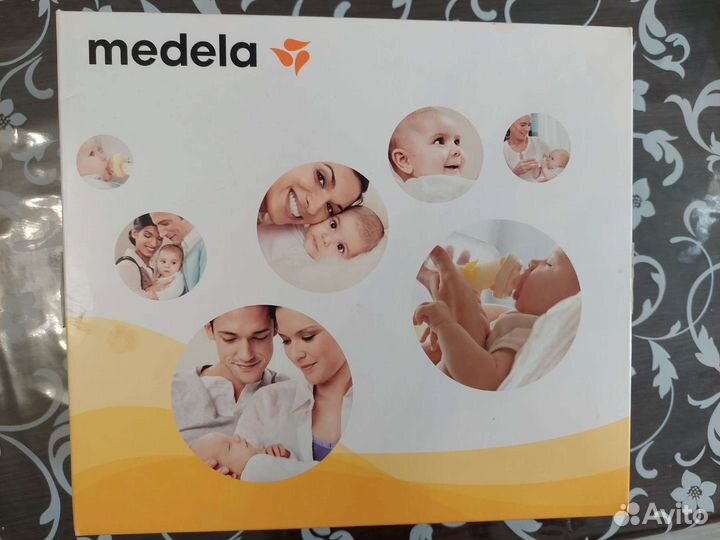 Молокоотсос medela электрический