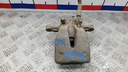 Суппорт тормозной задний правый toyota avensis T25