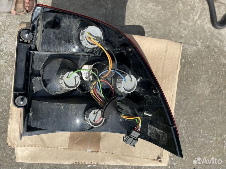 Фара левая задняя priora