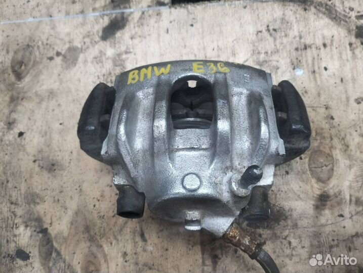 Суппорт тормозной передний левый BMW 3 E36