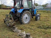 Покос травы трак�тором