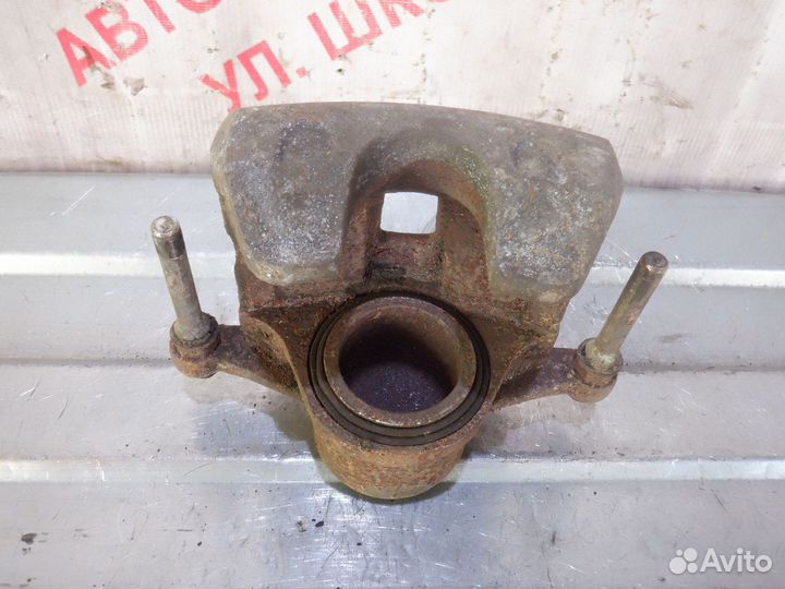 Суппорт тормозной передний левый Опель Инсигния