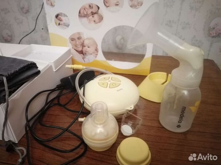 Молокоотсос medela электрический