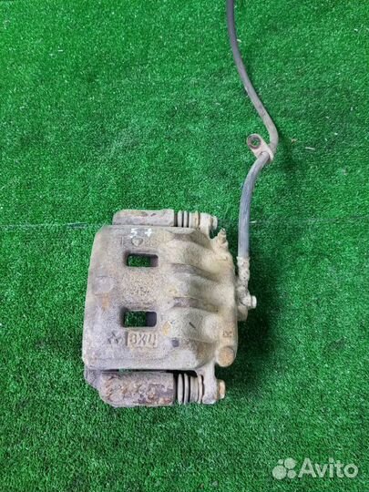 Суппорт тормозной передний левый Subaru Legacy