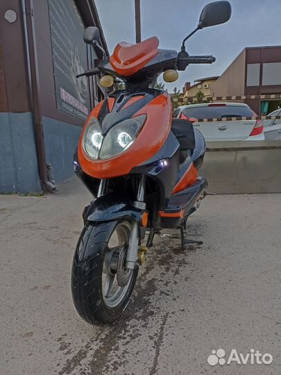 Скутер omaks
