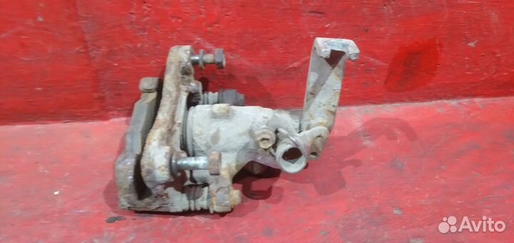 Суппорт задний левый Nissan Almera N16 Альмера