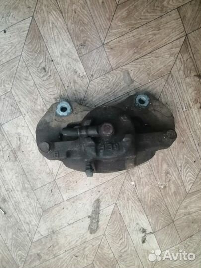 Суппорт передний (правый левый ) Mitsubishi Lancer