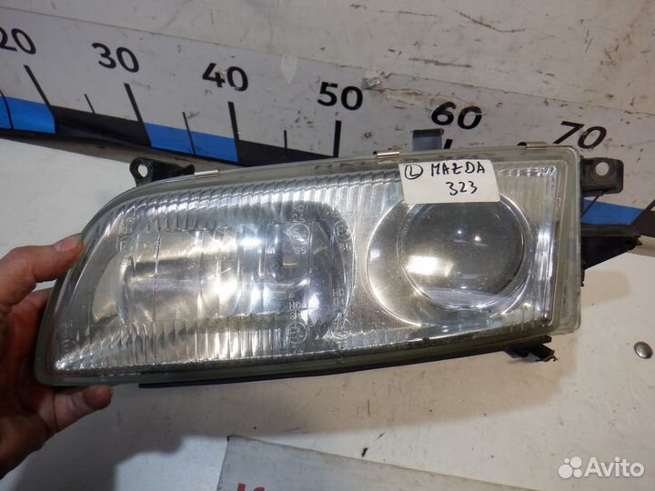 Фара левая Mazda 323