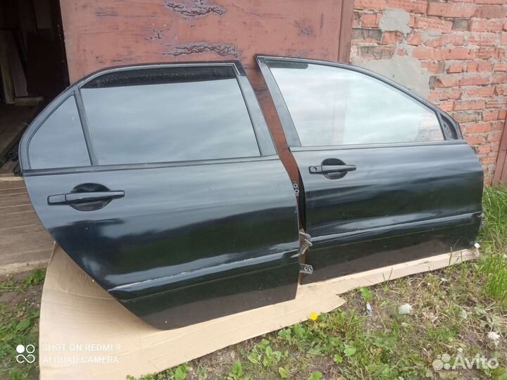 Двери на mitsubishi lancer 9