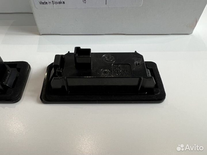 Фонарь подсветки номера BMW