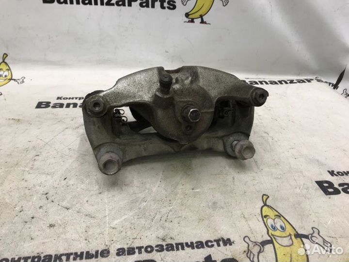 Суппорт тормозной передний левый Mazda 3 BM