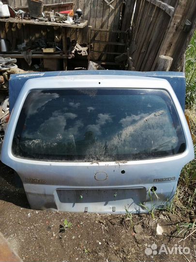 Дверь мазда дэмио