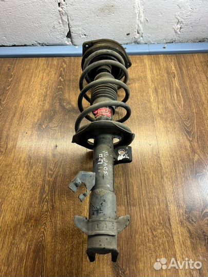 Стойка подвески передняя правая Nissan Tiida С11