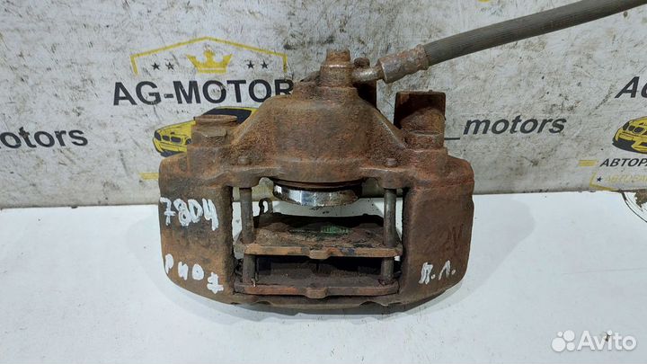 Суппорт тормозной передний левый Kia Rio 1