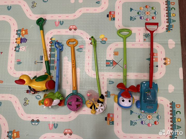 Игрушка каталка с ручкой