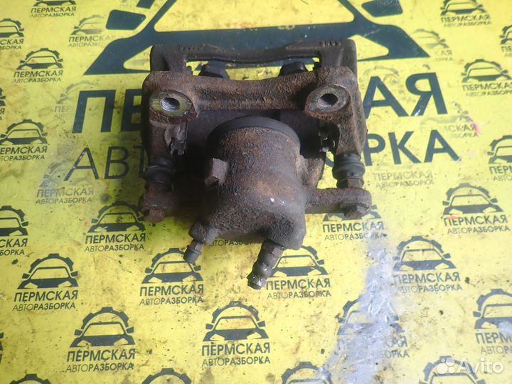 Суппорт передний правый Nissan Almera G15