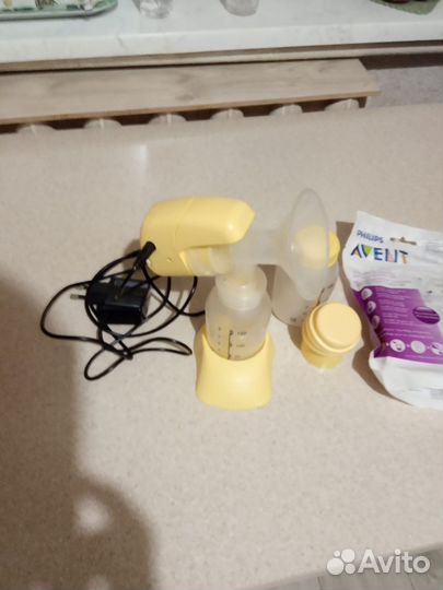 Молокоотсос medela электрический