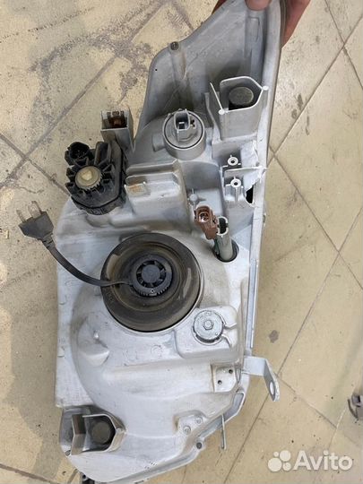 Фара левая Toyota Corolla axio nze141