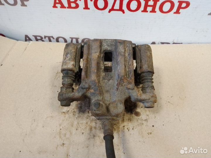 Суппорт тормозной задний левый Nissan Pathfinder