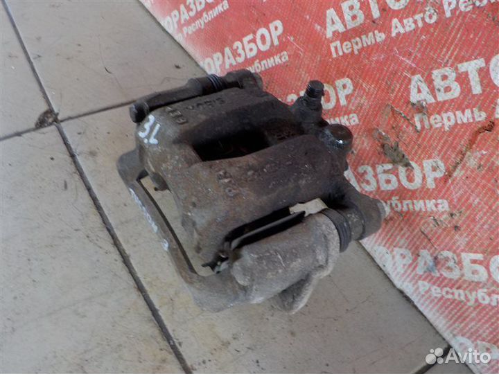 Суппорт тормозной задний левый Hyundai Tucson (W5)