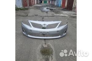 Передний бампер тойота королла е150 серебрисытй