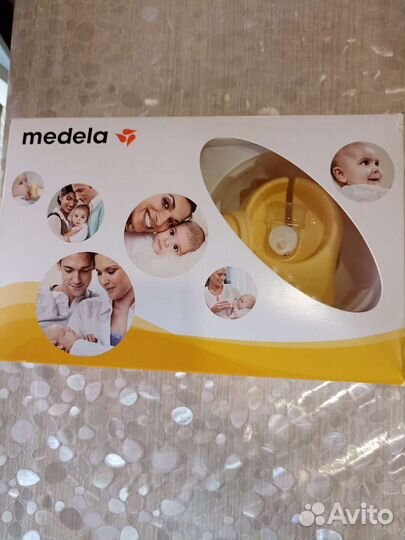 Молокоотсос medela электрический