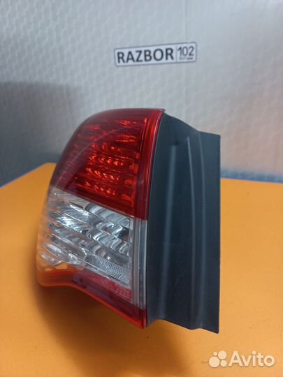 Фонарь левый наружний Nissan Almera G15