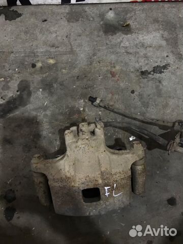 Суппорт передний левый Mitsubishi Lancer 10