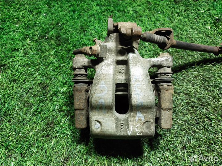 Суппорт тормозной задний левый Opel Astra H