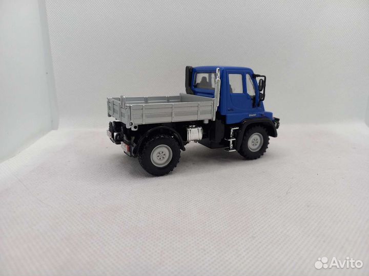 Mercedes Unimog U400,бортовой 1:43 Welly