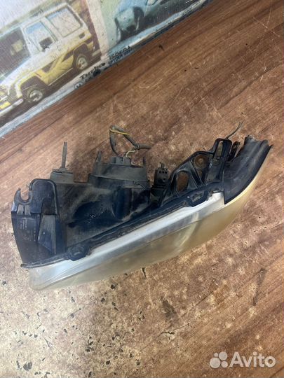 Фара левая оригинал Мазда Трибьют