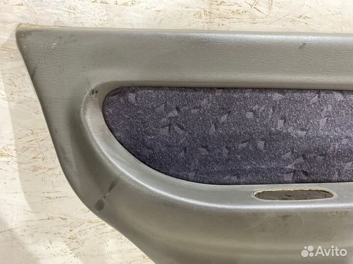 Обшивка боковой двери задняя левая Kia Spectra