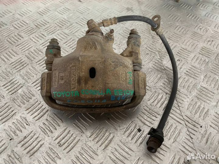 Суппорт тормозной левый Тойота Королла EE107V