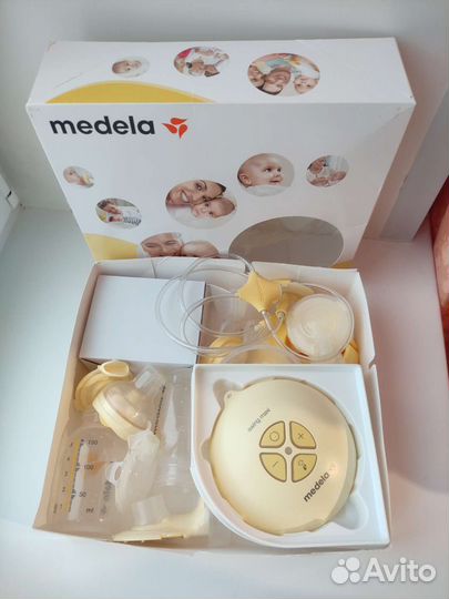 Молокоотсос Medela Swing Maxi & Calma двойной